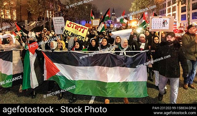 02 December 2023, Hamburg: Participants in a pro-Palestinian demonstration march through the city center. Since the bloody attack on Israel by the terrorist...