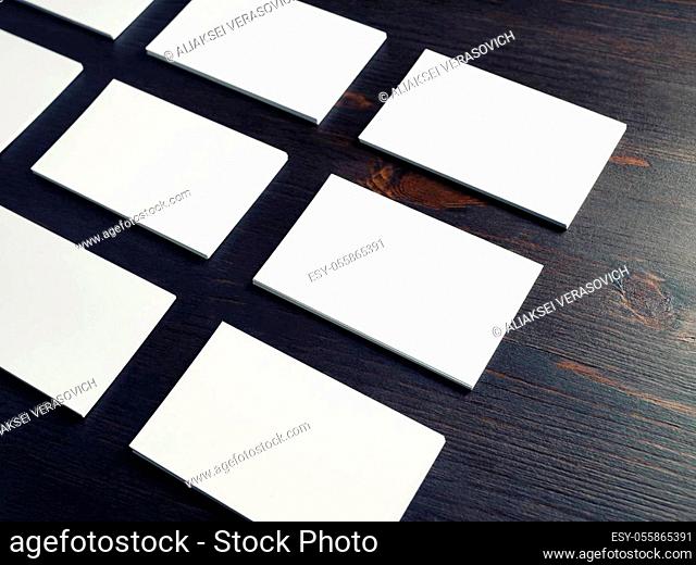 Photo of blank business cards on wooden background. Template for branding identity