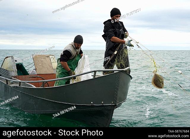 RUSSIA, GENICHESK - APRIL 30, 2023: Fishermen are seen in the Sea of Azov on the closing day of the season for catching turbot