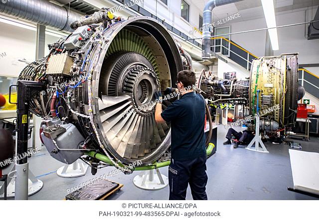 21 March 2019, Hamburg: A man is working on the engine of an aircraft in a Lufthansa Technik workshop. On the same day Lufthansa Technik's Annual-Pk takes place