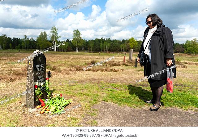 28 April 2019, Lower Saxony, Lohheide: Zsuzsa Misur, survivor of the Bergen-Belsen concentration camp, stands in front of the memorial stone for Margot and Anne...