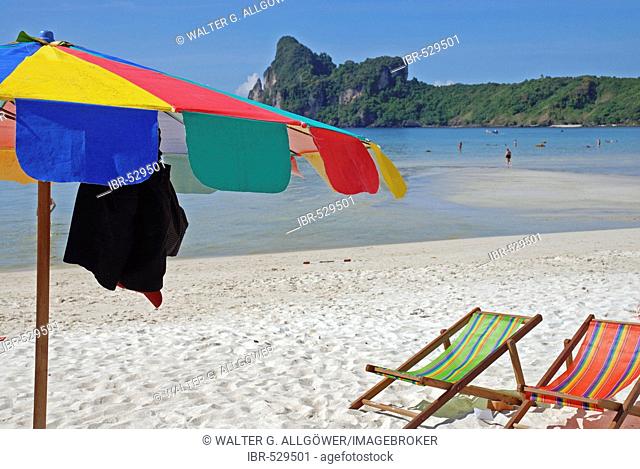 Beach with sun shade and deck chairs, Kho Phi Phi, Thailand, Asia