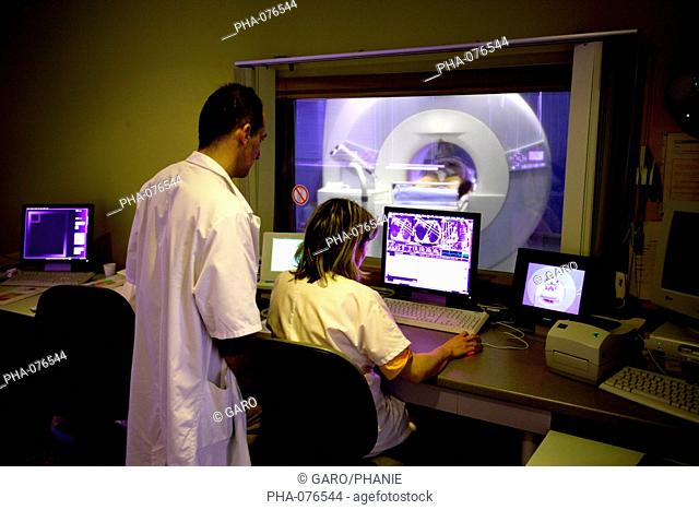 Lens Hospital, France. Patient undergoing MRI scan in the first high field ultra short bore MRI. The high height of the bore of the device makes it accessible...