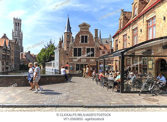 Tourists in a restaurant in the city center of Bruges a famous medieval town in Belgium