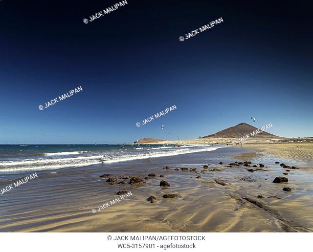 el medano tourist beach and montana roja famous landscape in tenerife spain