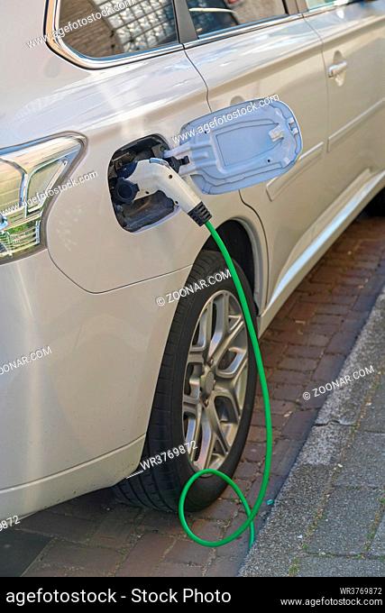 Charging Cable Electric Car Plug in at Street