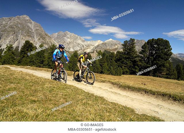 Mountain biker close Tschierv, Canton of Grisons, Switzerland