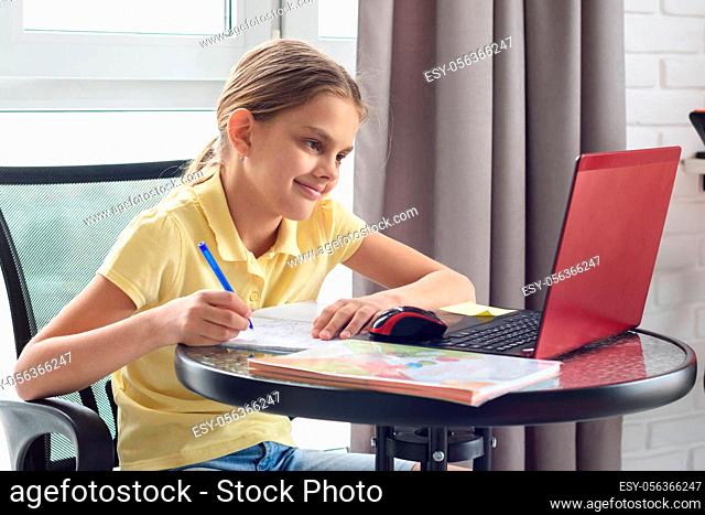 Girl enjoys doing online lessons