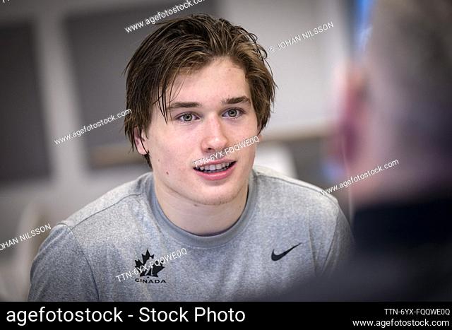 Macklin Celebrini (17) is interviewed when Canada's team trains in Limhamns Ice Hall in Malmö, Sweden, 18 December 2023 ahead of the JVM (2024 IIHF Junior WC)