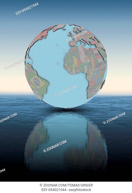 Gambia with national flag on globe above water surface. 3D illustration
