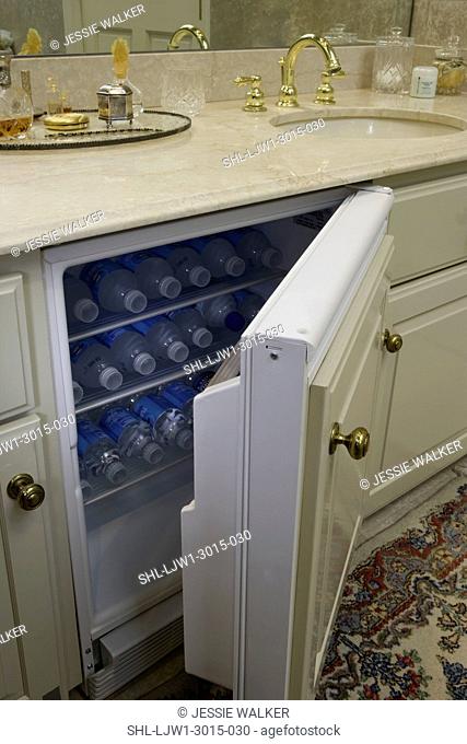 BATHROOM: hidden small refrigerator with water bottles in master bathroom