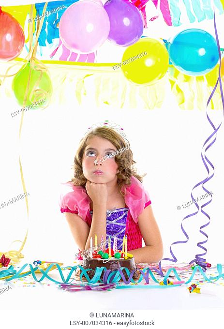 child sad kid crown princess in birthday party bored gesture and chocolate cake
