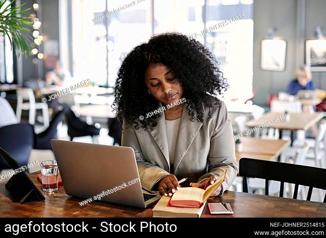 Woman working in cafe