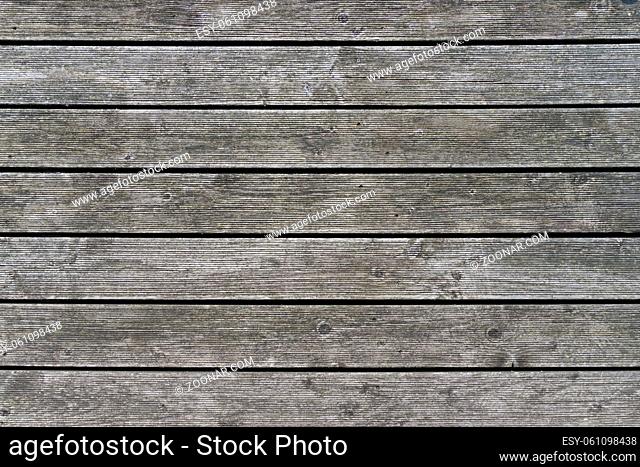 Natural brown and gray barn wood wall. Wall texture background pattern. Wood planks, boards are old with a beautiful rustic look, style