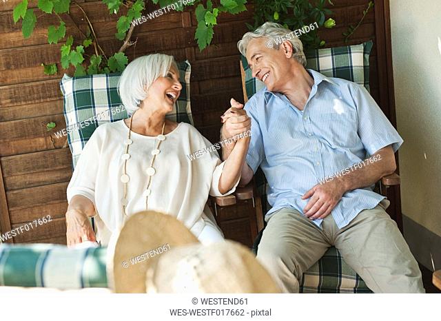 Germany, Bavaria, Man and woman relaxing, smiling
