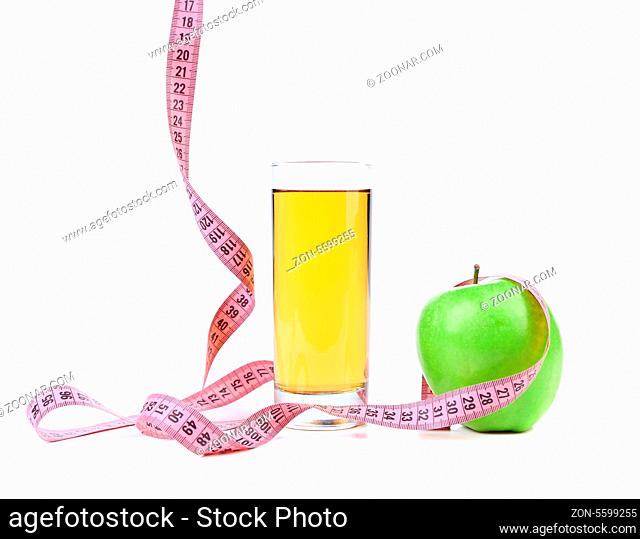 Green apple and juice with measuring tape