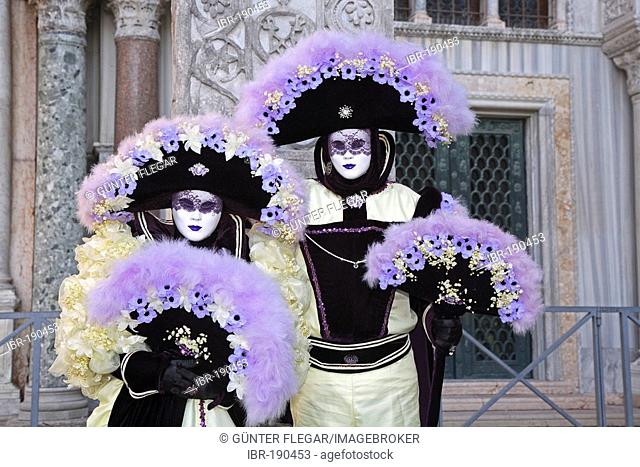 Two masks at the carnival in Venice, Italy