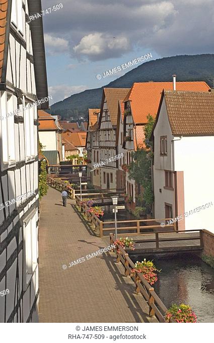Timber framed traditional houses alongside the millrace, Anweiler, Rheinland-Pflaz, Germany, Europe