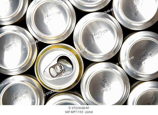 Row of beer cans with one opened can, Germany