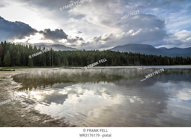 Mist on Lost Lake, Ski Hill and surrounding forest, Whistler, British Columbia, Canada, North America