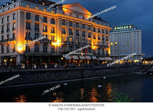 Four Seasons Hotel des Bergues , Rhone river, downtown of Geneva at dusk, Switzerland