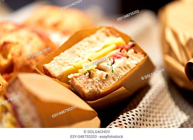 food, cooking and sale concept - craft sandwich at grocery store