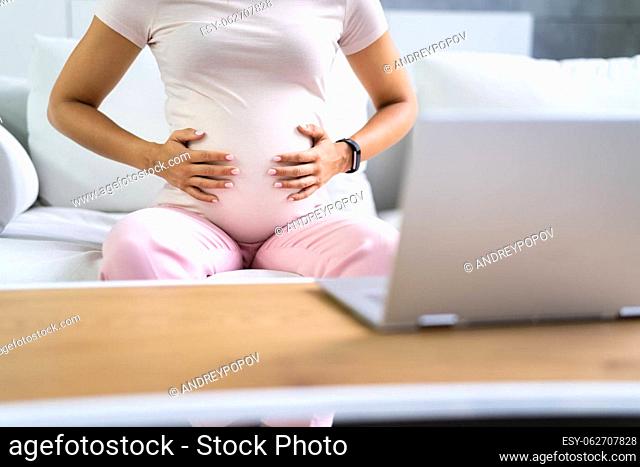 Young Pregnant Woman Suffering From Nausea At Home