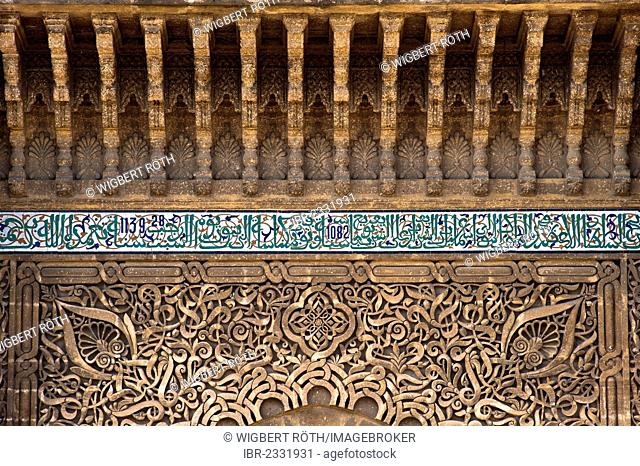 Stucco ornaments and tile mosaics with Koranic verses on the gate to the mausoleum and the Moulay Ismail mosque, Meknes, Morocco, Africa