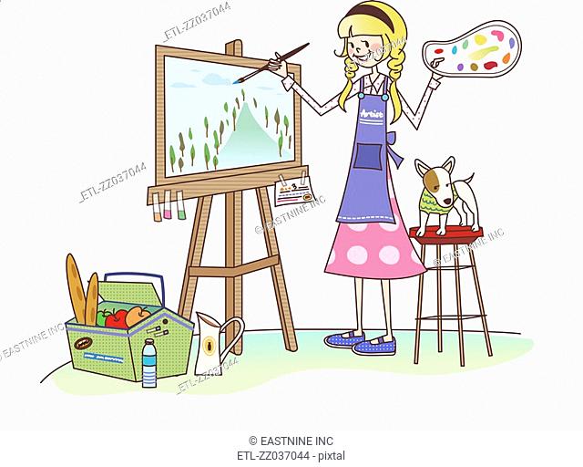 Woman painting on a canvas and smiling