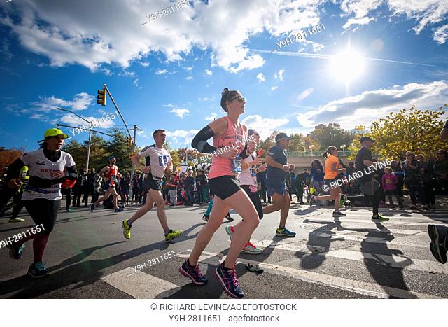 Runners pass through Harlem in New York near the 22 mile mark near Mount Morris Park on Sunday, November 6, 2016 in the 46th annual TCS New York City Marathon