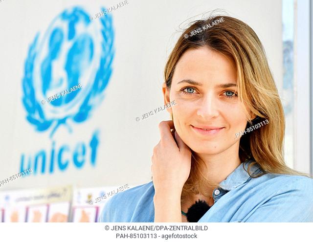 EXCLUSIVE - UNICEF ambassador Eva Padberg stands by a UNICEF logo at a school in the Dahuk region, Iraq, 19 October 2016