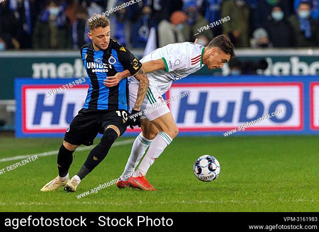 Club's Noa Lang and OHL's Sofian Chakla fight for the ball during a soccer game between Club Brugge and OH Leuven, Thursday 23 December 2021 in Brugge