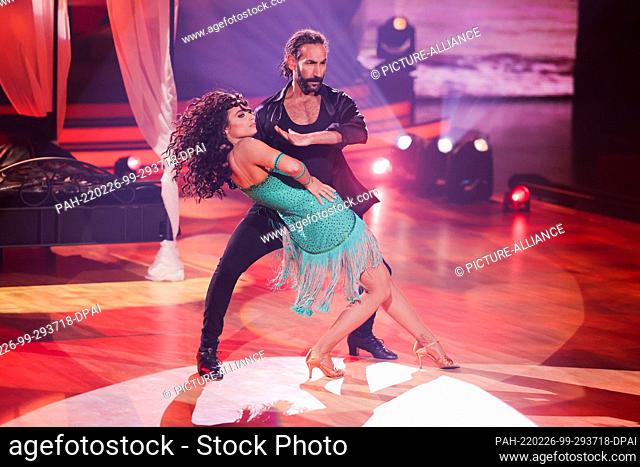25 February 2022, North Rhine-Westphalia, Cologne: Amira Pocher, presenter, and Massimo Sinato, professional dancer, dance in the RTL dance show ""Let's Dance...