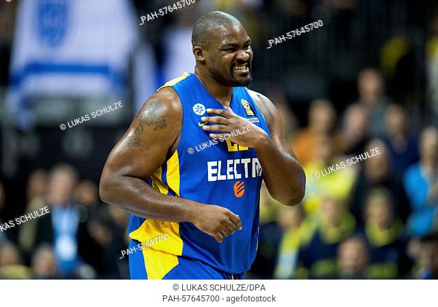 Tel Aviv's Sofoklis touches his shoulder during the men's Euroleague basketball game between Alba Berlin and Maccabi Tel Aviv at O2 World in Berlin,  Germany