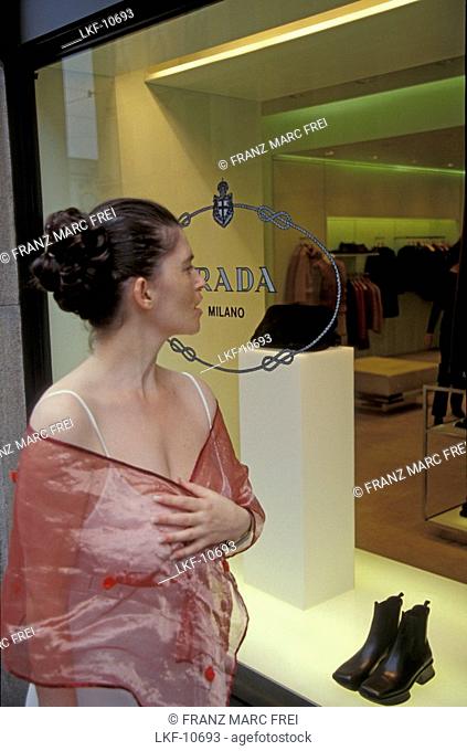 Woman looking at shop display, Residenzstrasse, Munich, Germany