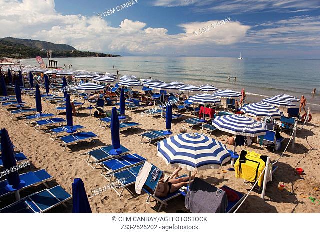 Parasols and sunbeds at the sandy beach, Cefalu, Sicily, Italy, Europe