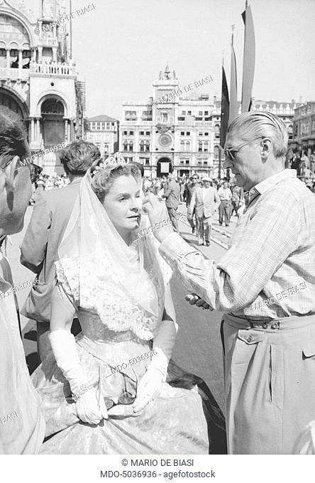 German actress Magda Schneider, as Ludovika of Bavaria, having her her makeup done on the set of Sissi - Fateful Years of an Empress. Venice, 1957