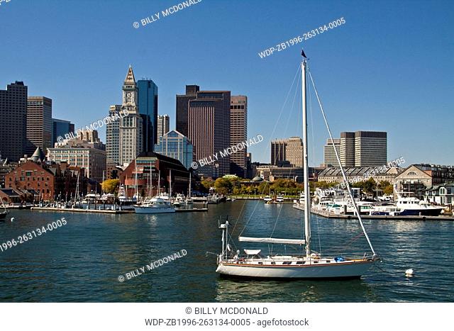 Sailboats Moored In Boston Harbor With The Custom House Tower In The Distance, Boston, Massachusetts, USA
