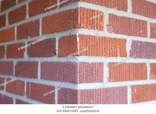 Building corner where two red brick walls meet