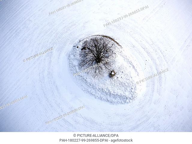 dpatop - Snow covering an old burial mound in Gross Stieten, Germany, 27 February 2018 (aerial shot taken with a drone). The Michelenburg burial mount was first...