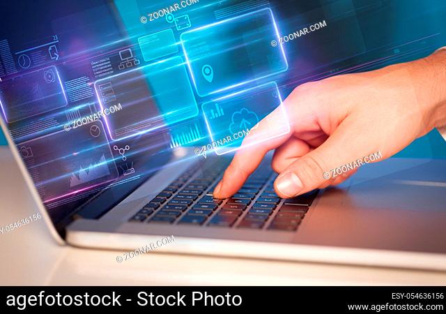 Hand using laptop with database reports and online work concept