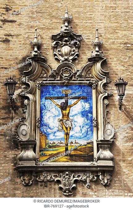 Picture of Jesus on the cross, ceramics, exterior wall of the church at Plaza de la Encarnacion, Seville, Andalusia, Spain