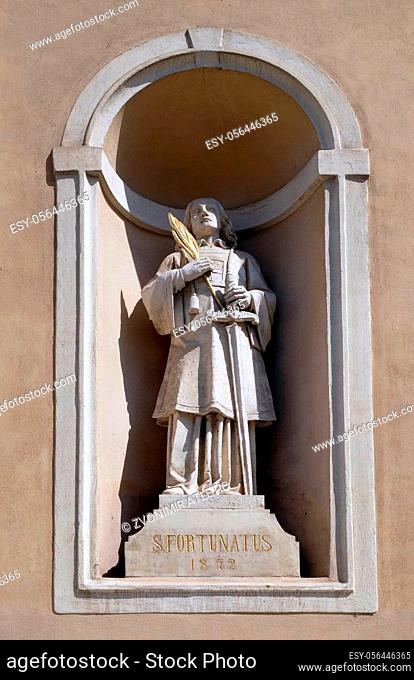 Saint Fortunatus on the facade of St Nicholas Cathedral in Ljubljana, Slovenia