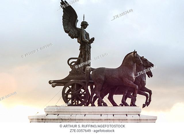 Statue of Goddess Victoria on a Quadriga (Winged Victory Statue) at sunset. Victor Emmanuel II Monument (Monumento Nazionale a Vittorio Emanuele II)