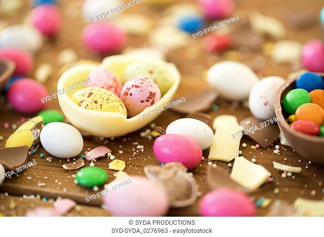 chocolate easter eggs and candy drops on table