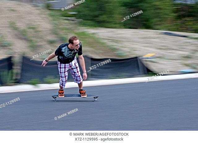 Man riding the Longboard in Spokane Washington