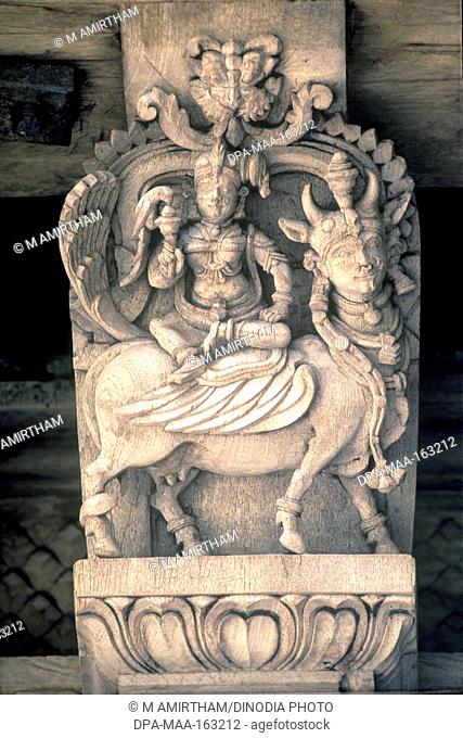Goddess Meenakshi on kamdhenu wooden carving statues in old temple chariot at Madurai ; Tamil Nadu ; India