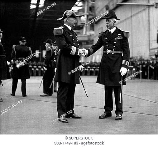Admiral Latimer shaking hands with Captain Harry Ervin Yarnell on the deck of the USS Saratoga, Philadelphia Naval Yard, Pennsylvania, USA, 1931
