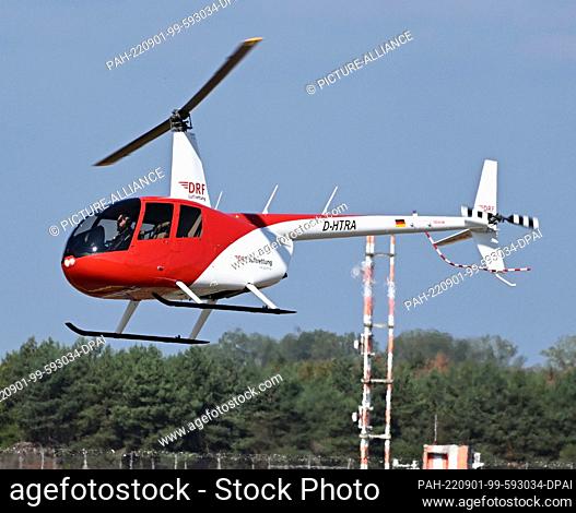 01 September 2022, Baden-Wuerttemberg, Rheinmünster: A Robinson 44 Raven II training helicopter of the DRF Luftrettung is presented at Karlsruhe/Baden-Baden...