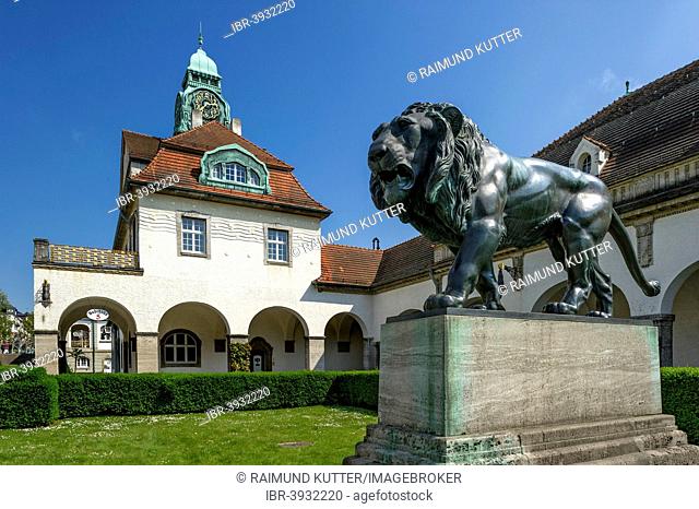 Bath houses and bronze sculpture Walking Lion by Heinrich Jobst, Sprudelhof courtyard, spa resort in Art Nouveau style, Bad Nauheim, Hesse, Germany